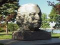 Arthur Fiedler's head is carved in ston and on display near the Hatch Shell in Boston