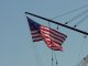A US flag flying on a mast of the USS Constitution in Boston