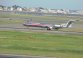 An American Airlines jet lands at Boston Logan International Airport