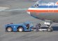 American Airlines jet being pushed away from the gate at Logan International Airport