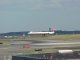 A TWA jet is just feet above touchdown on a runway at Logan International Airport in Boston