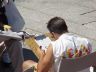 looking of the shoulder of an artist drawing a characture in Boston Quincy marketplace