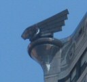 a close shot of one of the hood ormanent decorations on the Chrysler Building