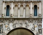 gargoyles adorn the front of an unknown building