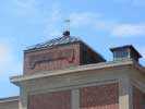 A weather vane on the toop of a roof at Saxonville Mills in Mass