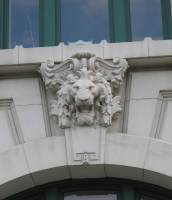 a clean lion's face on an outside wall