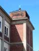 An old copper weathervane on the top of a tower at the Saxonville Mills