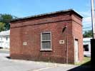 A brick shed stands alone at the Saxonville Mills